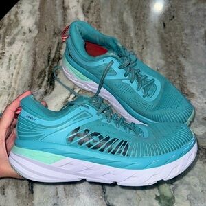 HOKA SIZE 9 WOMANS. Used with visible wear and tear. Please look at all pics!